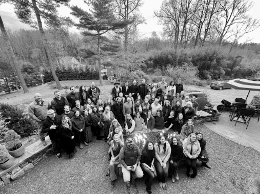 Large corporate group gathering at The Saluda Inn outdoor patio