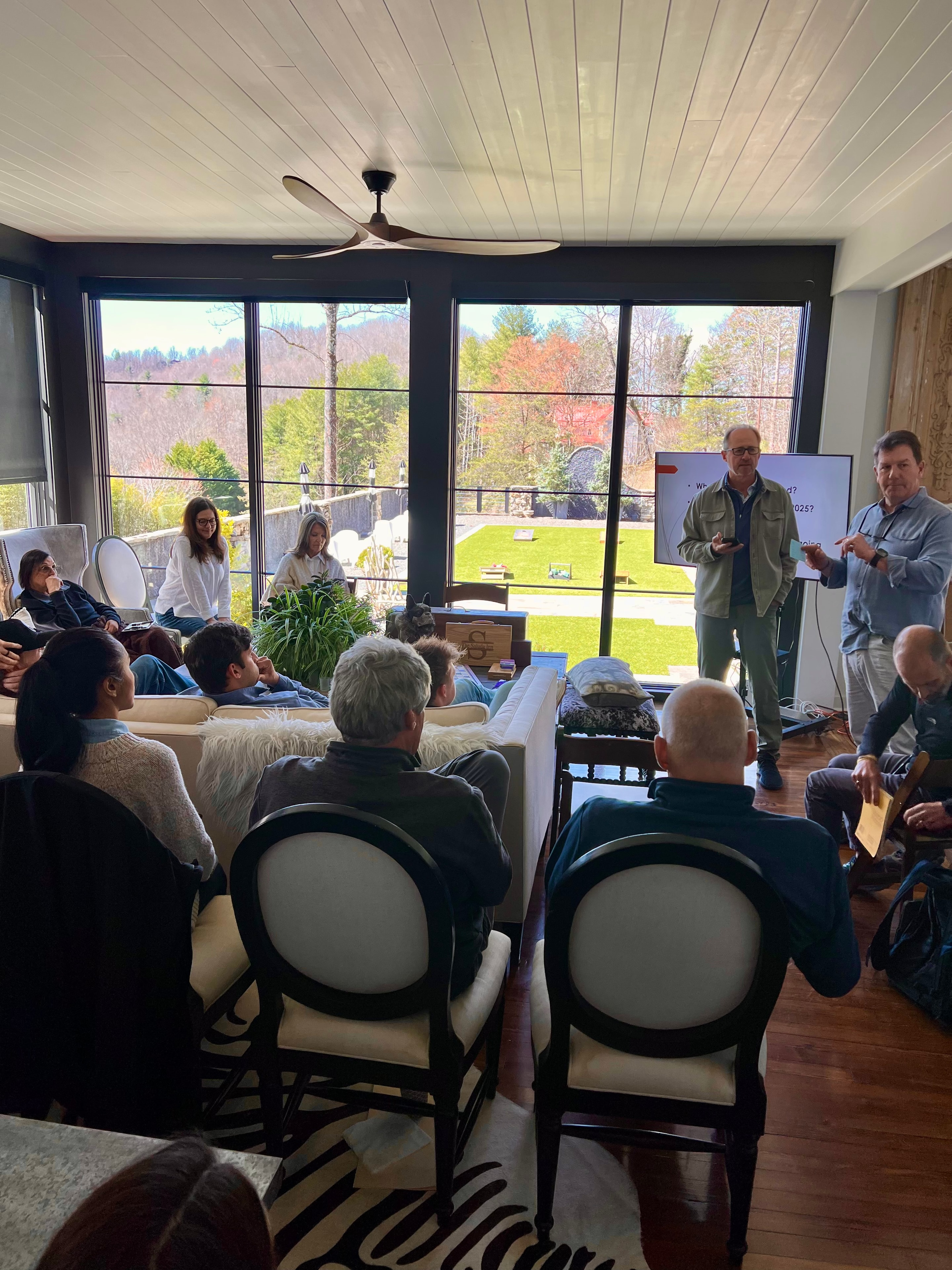 Corporate team presentation in The Saluda Inn sunroom overlooking the Grand Lawn