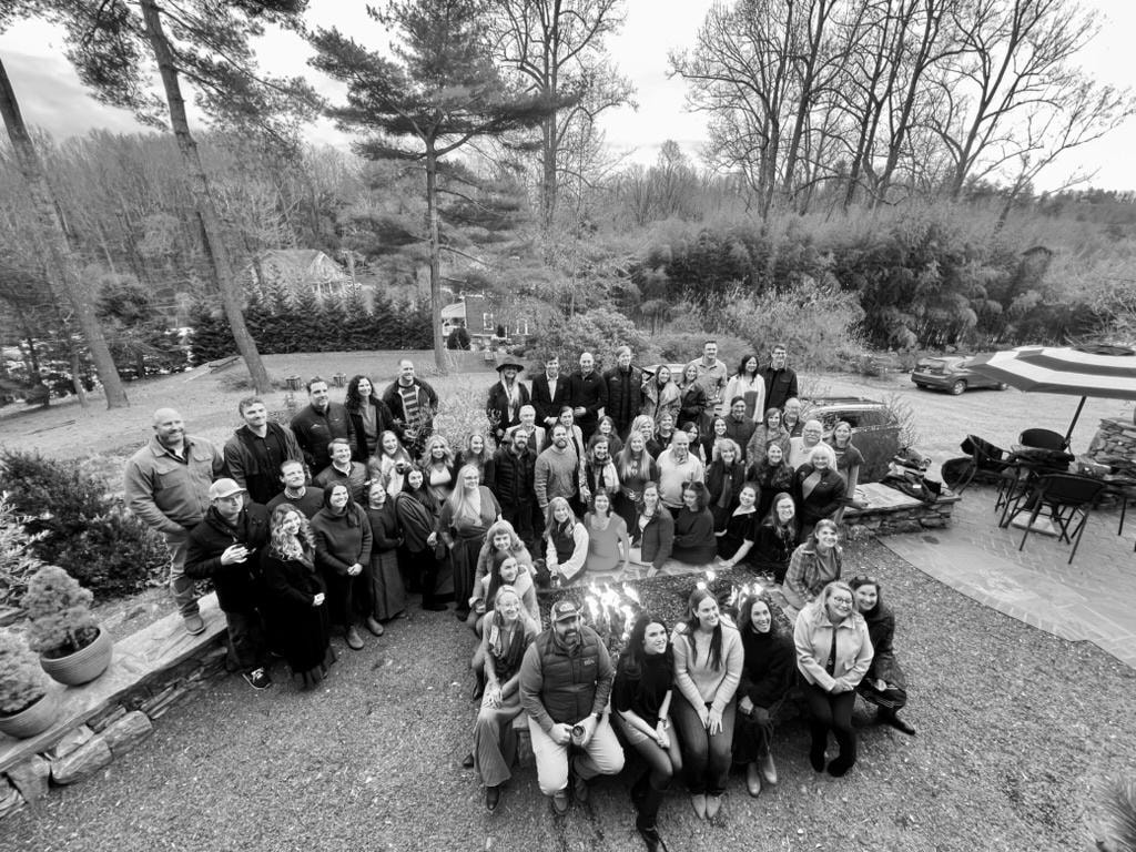 Looking Glass Reality Western NC Christmas Celebration at The Saluda Inn — large corporate group photo on the Grand Lawn