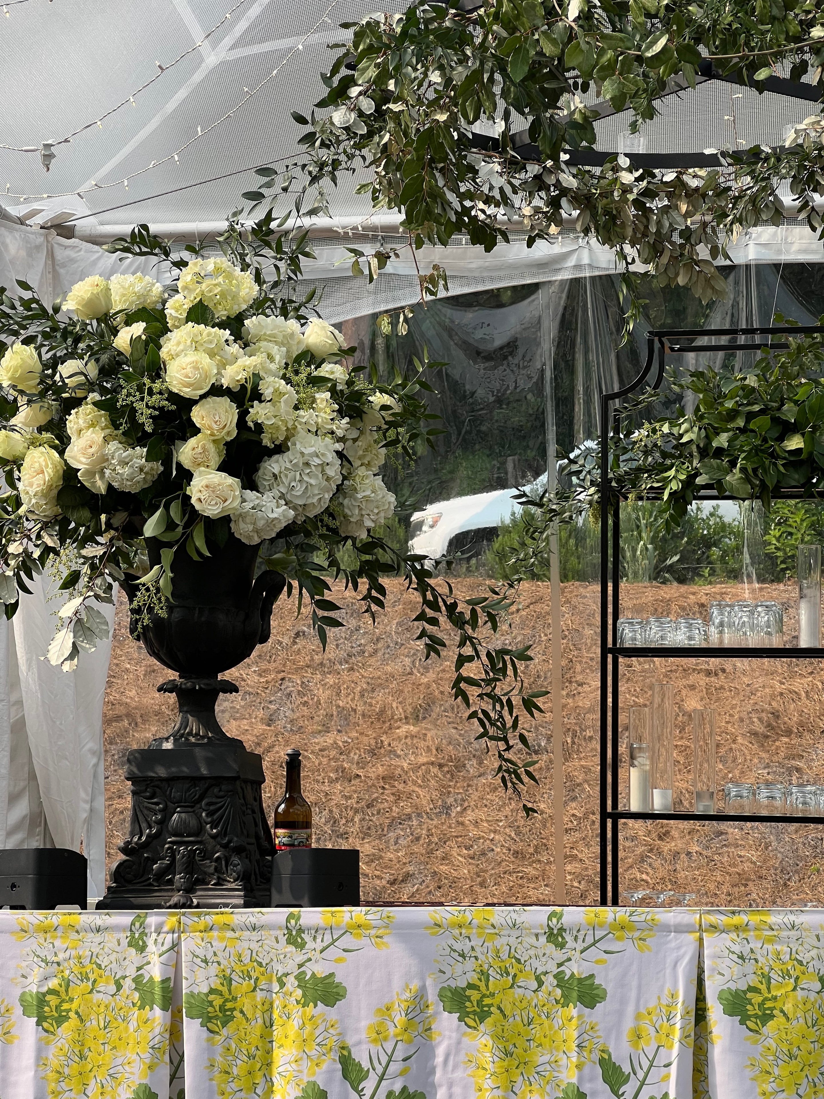 Wedding reception with green tablecloths and white hydrangea centerpieces at The Saluda Inn