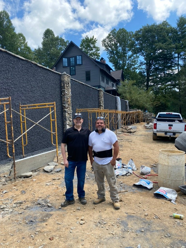 Stucco & stone columns — retaining wall taking its final form