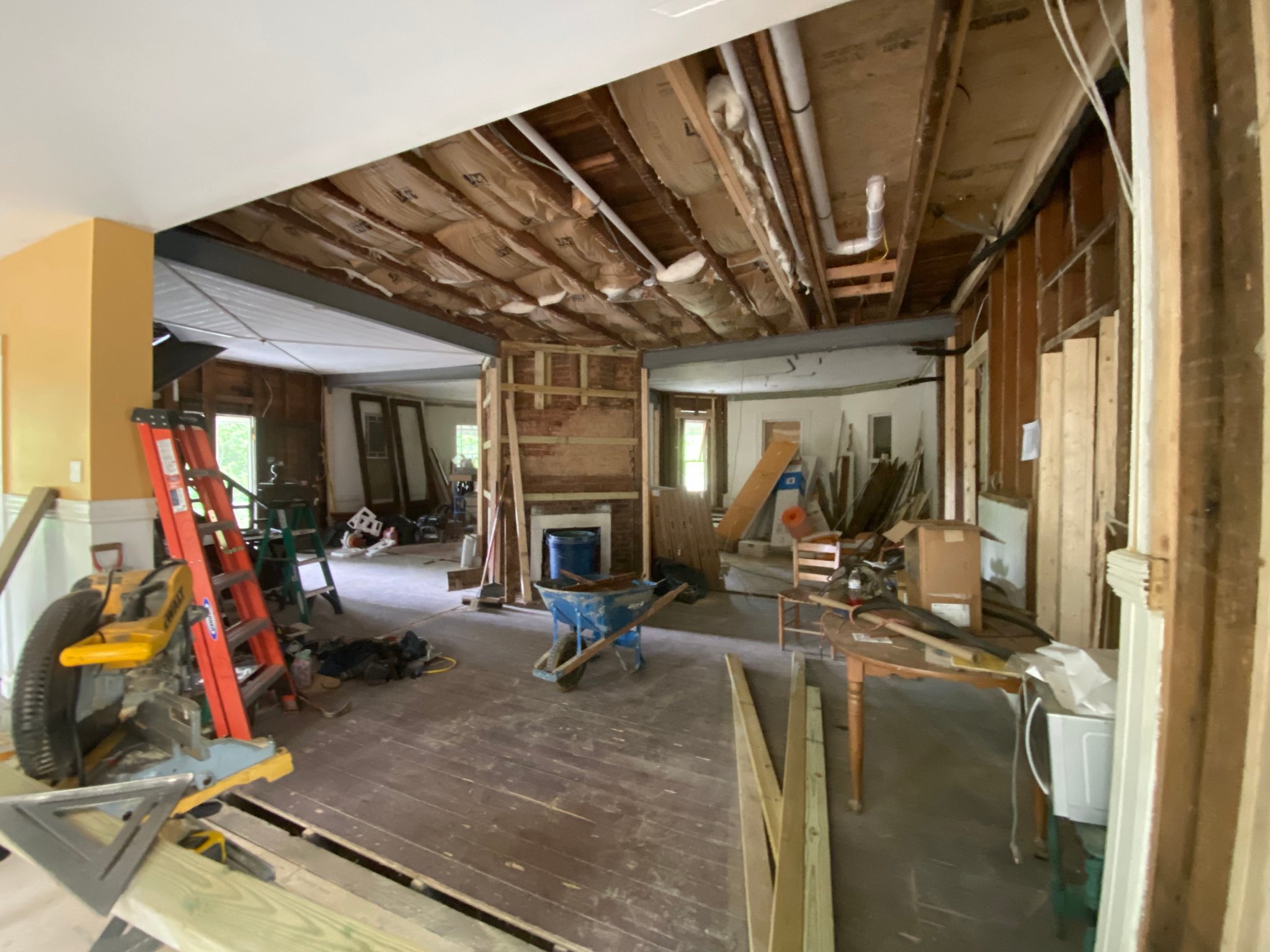 Main floor gut — original hardwood floors & exposed framing