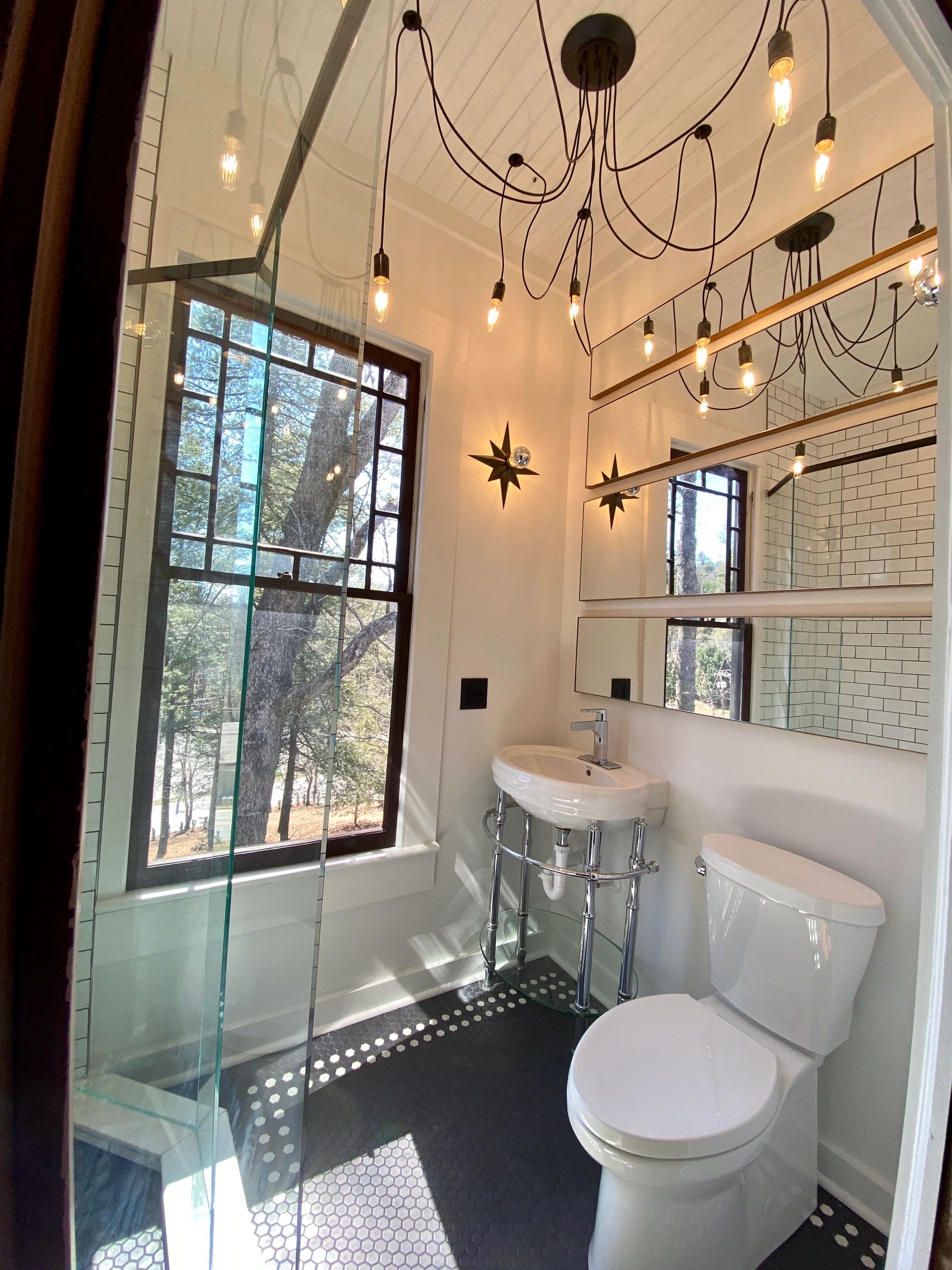 Bright bathroom with modern fixtures and large window