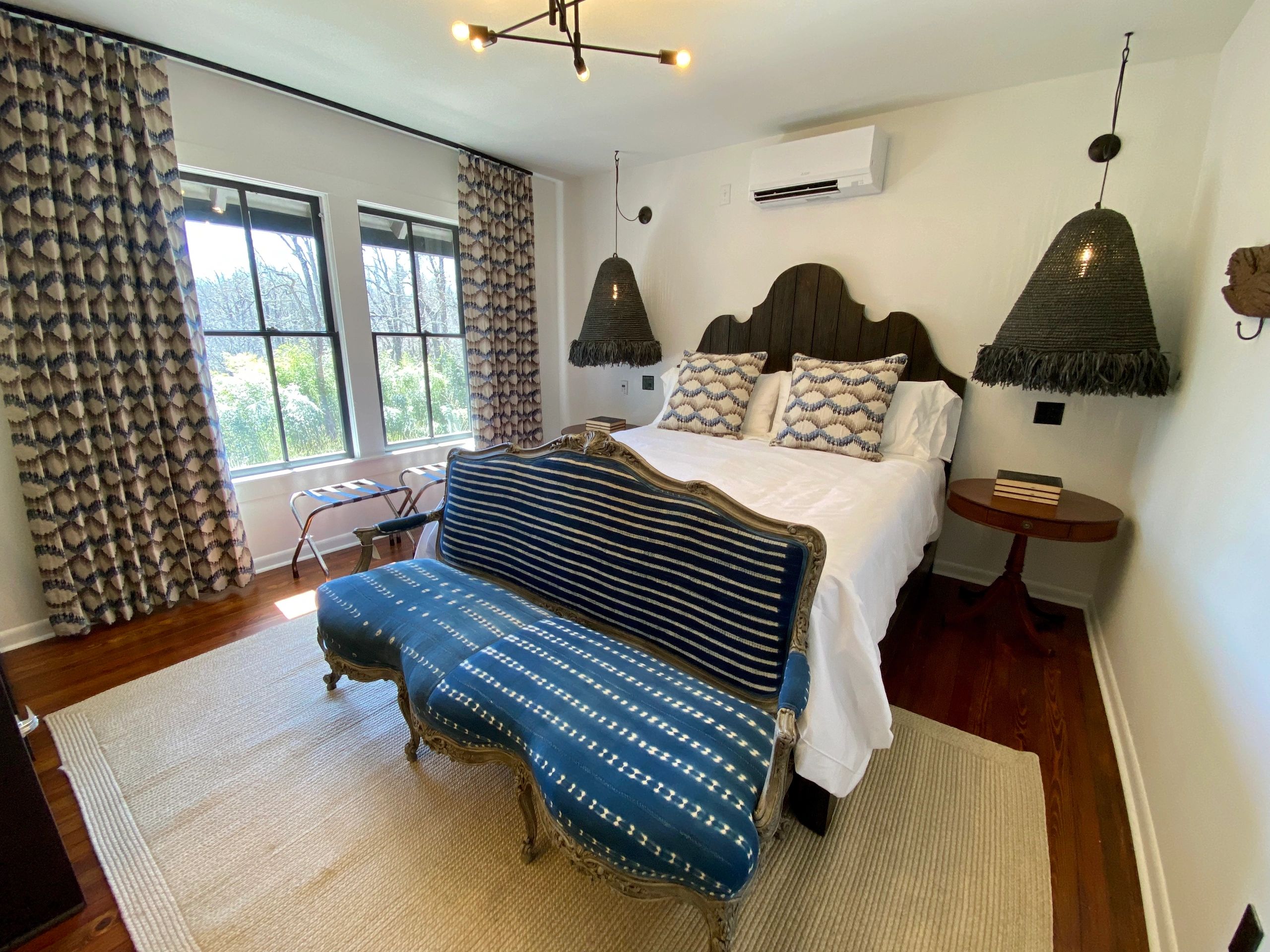 Elegant bedroom with vintage furniture and patterned textiles